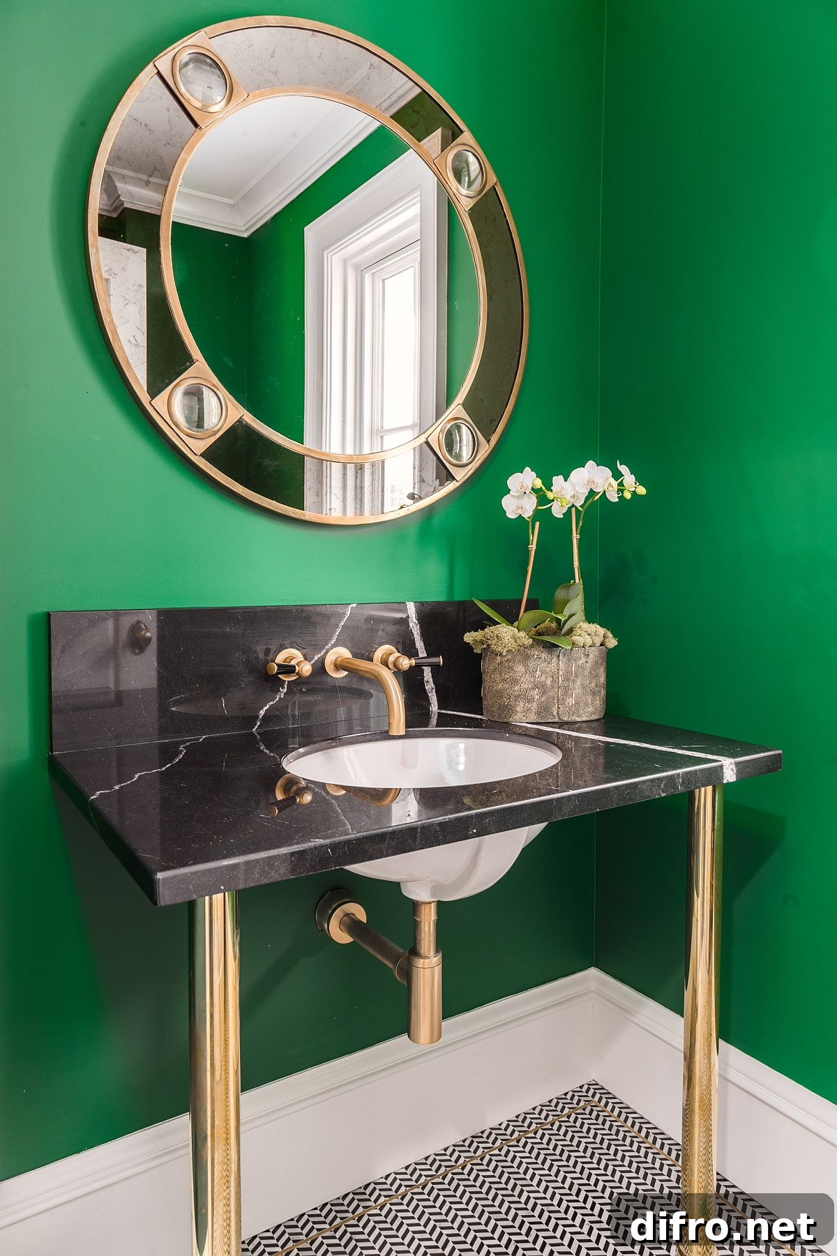 Green powder room with metallic vanity base and fixtures