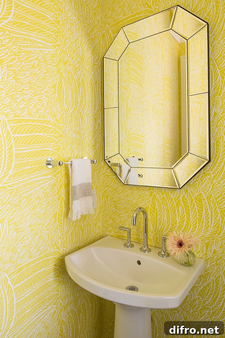 Yellow patterned wallpaper in a welcoming powder room