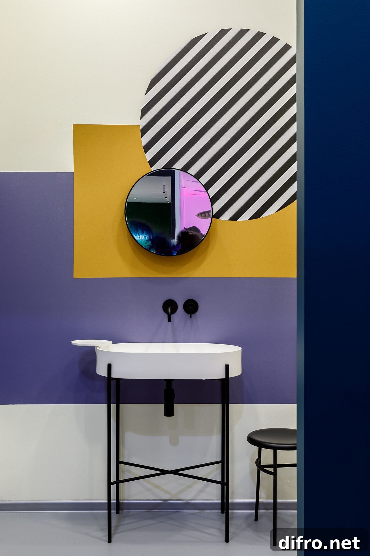 Multiple colors and stripes create an artistic powder room