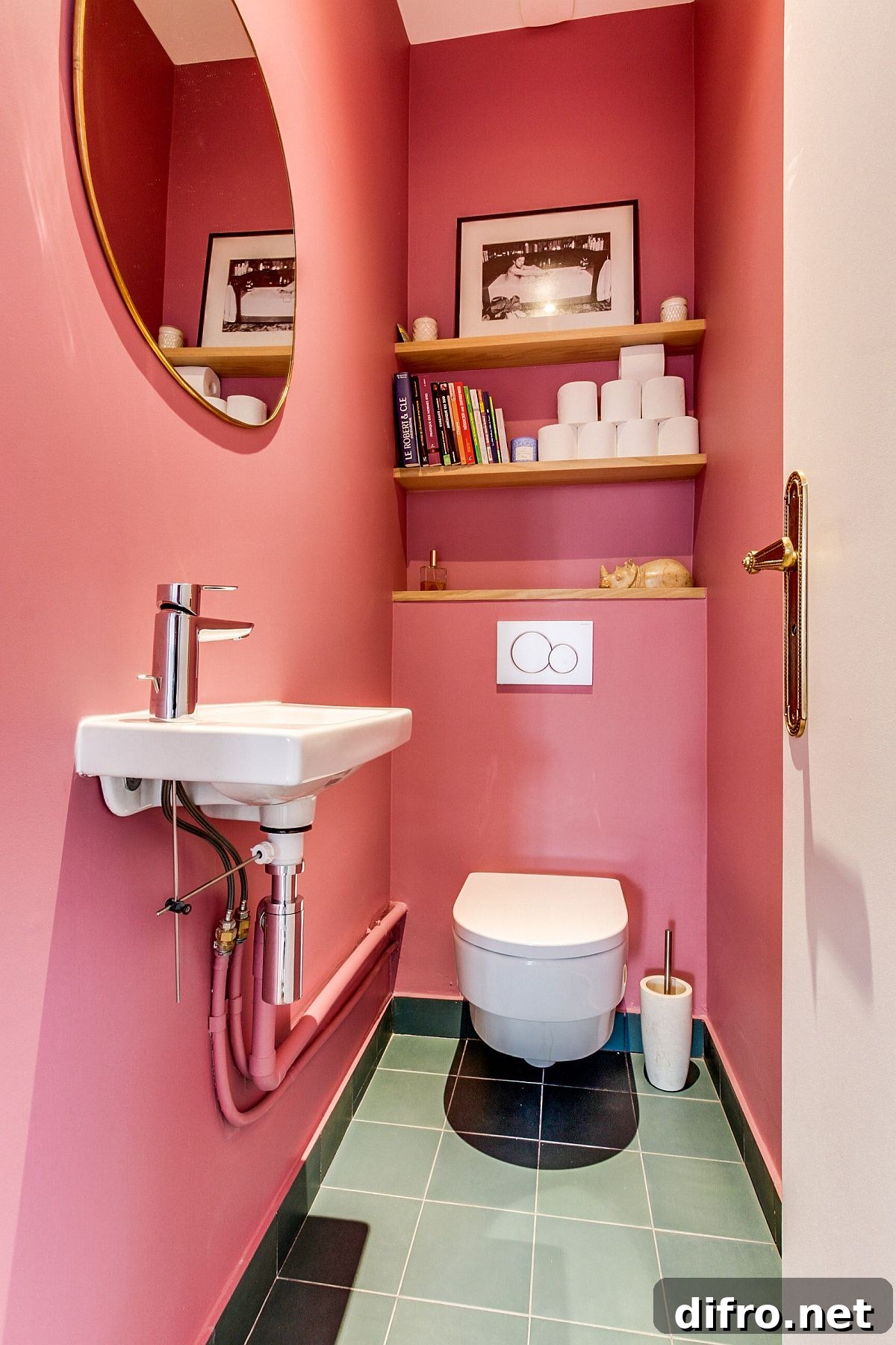 Glossy pink tiles brighten this powder room