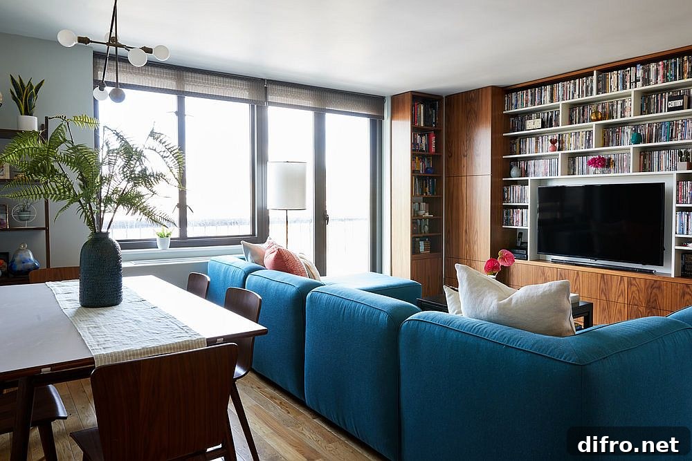Open-plan living with sectional separating kitchen and dining
