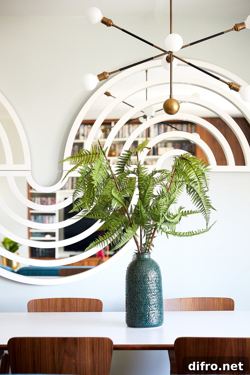 Dining area with artistic mirrored backdrop