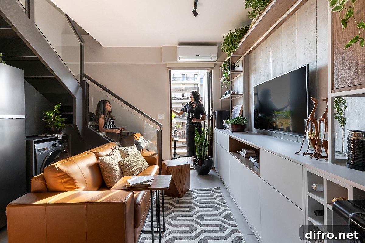 Lower level living area and social zone of the Simpatia Apartment in Brazil