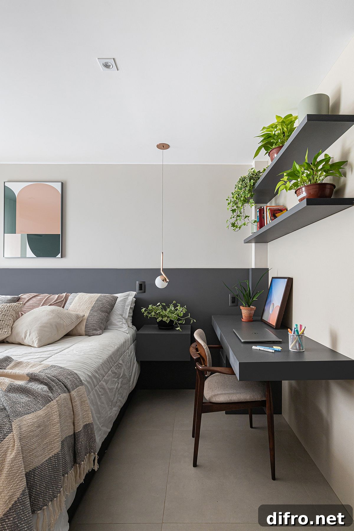 Gray half-wall, compact workspace and floating shelves in the small bedroom