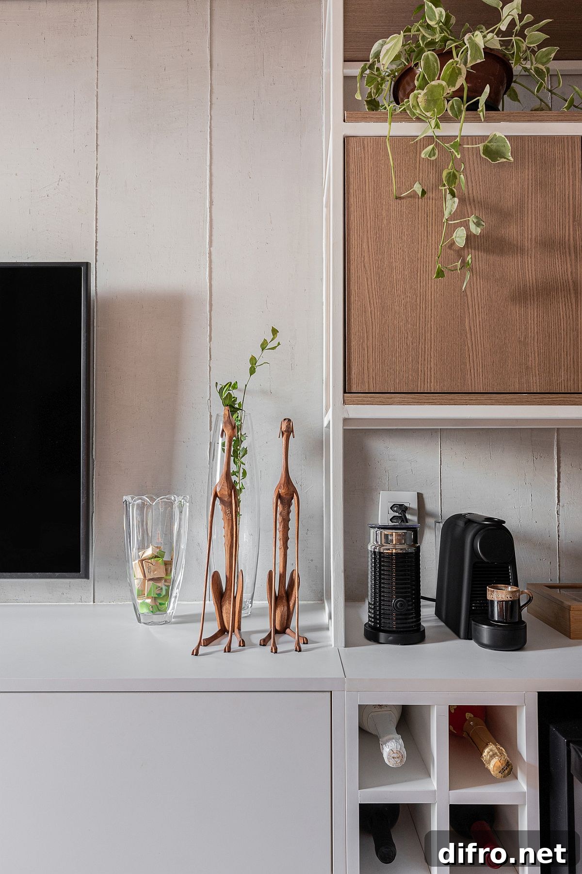 Beer cooler, ice maker and coffee maker next to the television