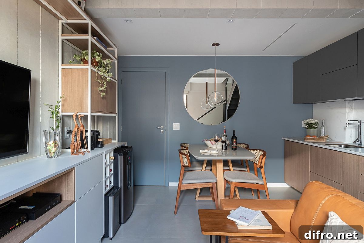 Blue, gray and wood shape the social zone and kitchen on the lower level