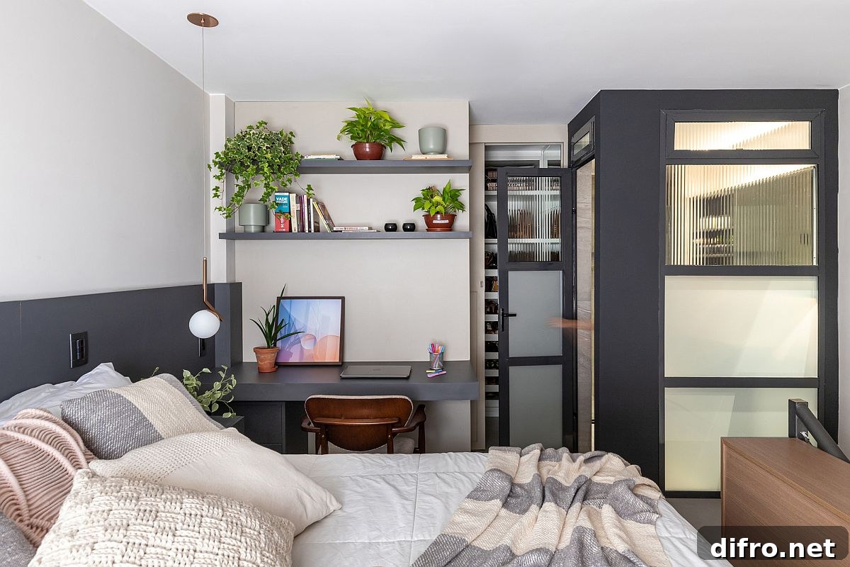 Modern bedroom in gray and white on the upper level with a space-savvy design