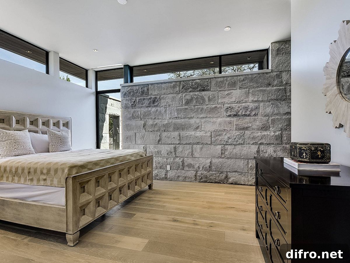 Stone accent wall in a neutral bedroom