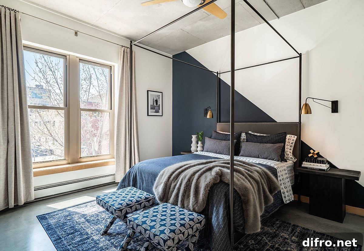 Dark gray and white accent wall in polished bedroom