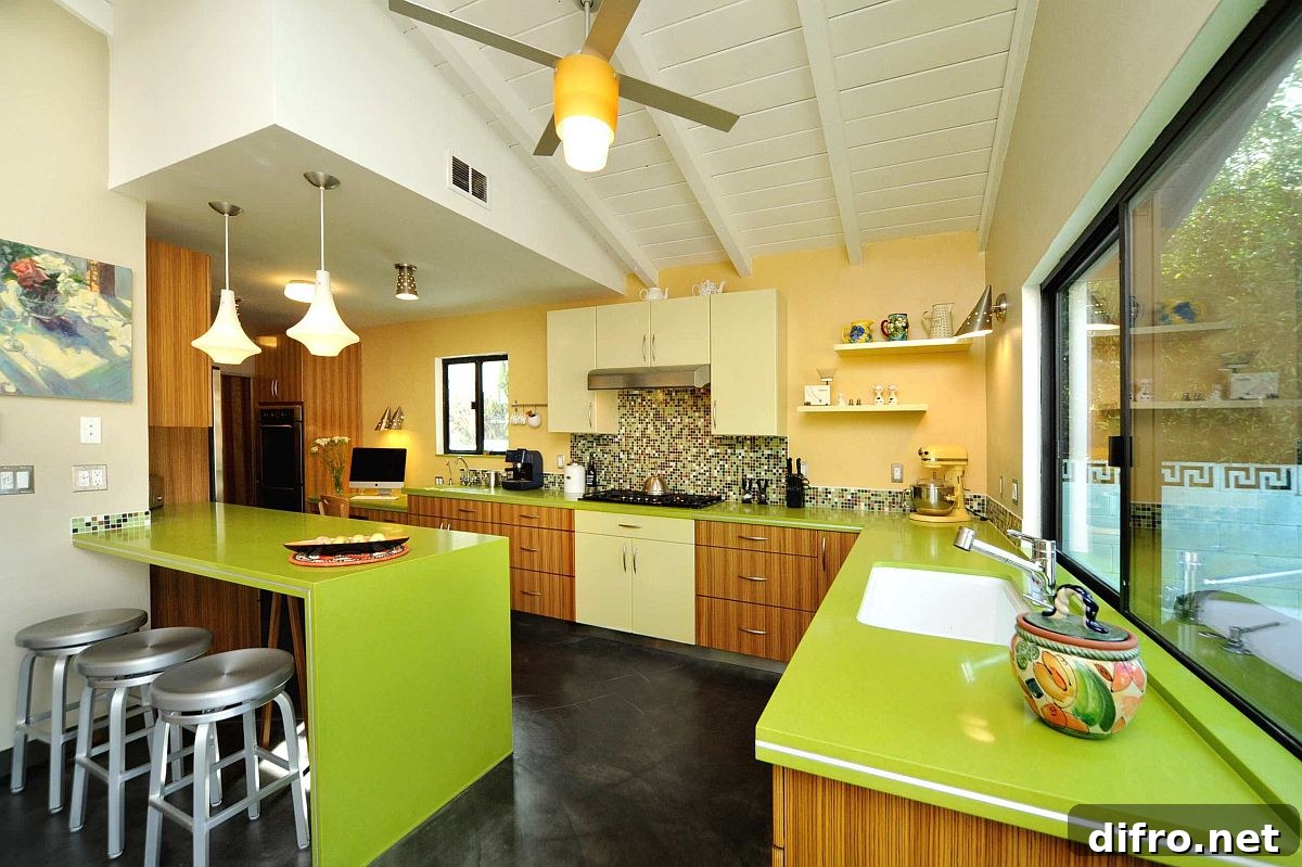 Mid-century kitchen with yellow accent wall and green countertops