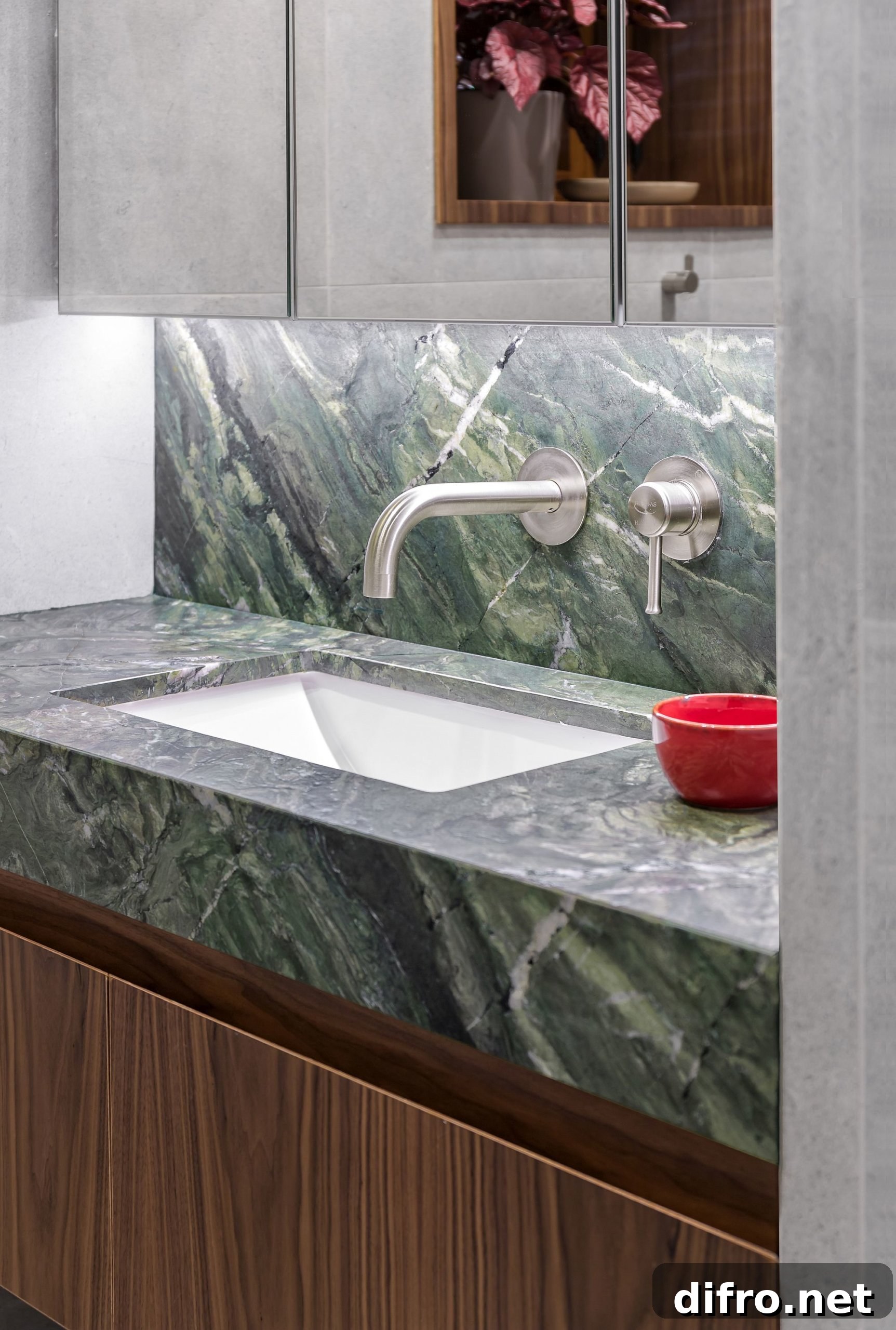 Walnut and green marble vanity in the bathroom