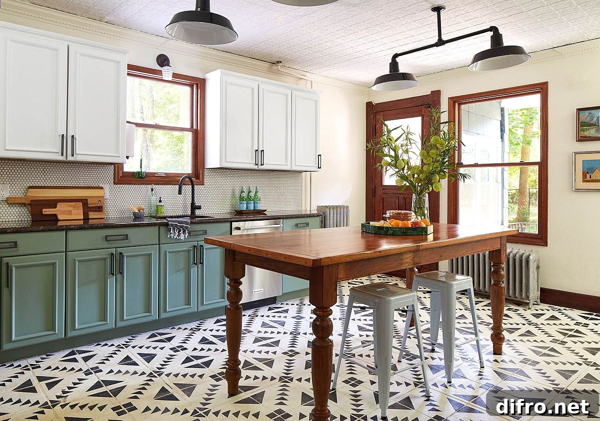 Green matte cabinets, classic island and patterned tiles in a spacious Victorian kitchen