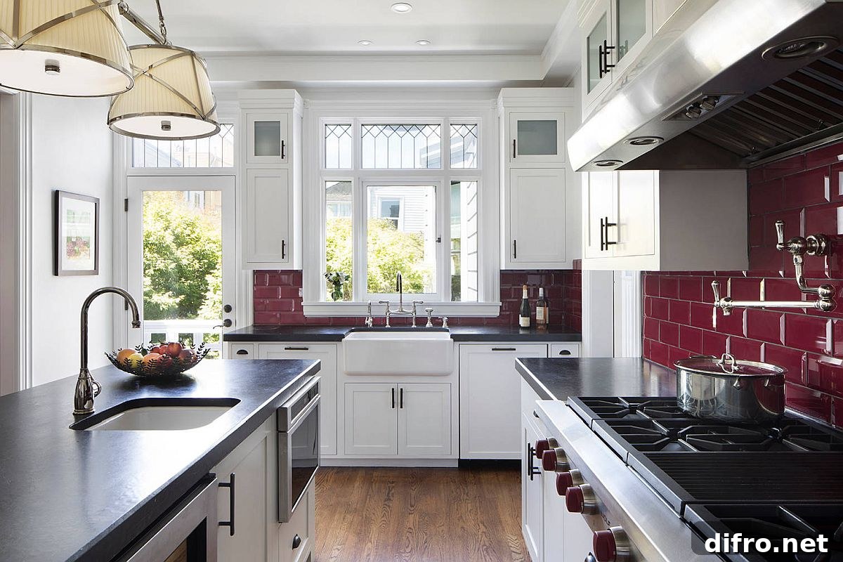 Dark maroon tiles create a dramatic backdrop in a U-shaped Victorian kitchen