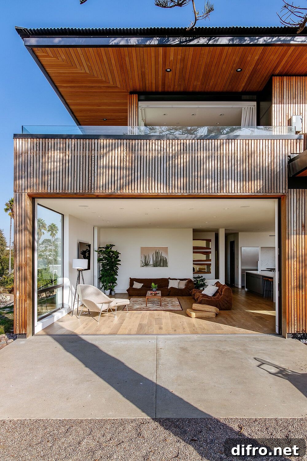 Living area with glass doors opening to the view