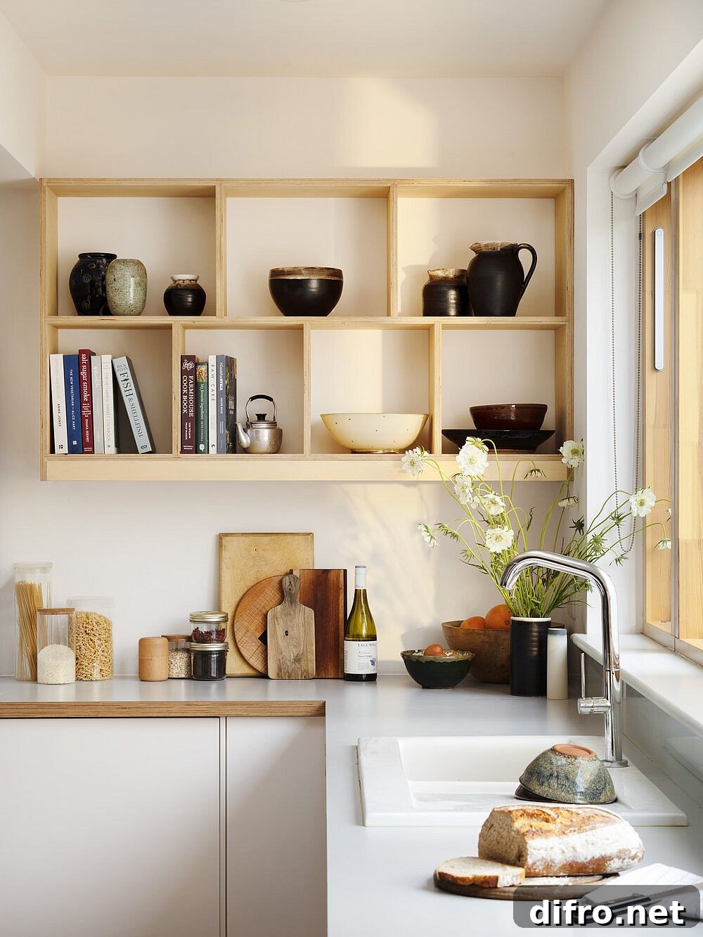 Open shelves create display in white kitchen