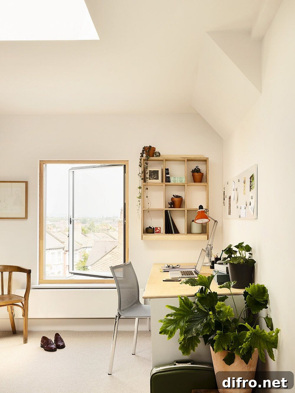 Upper level home office illuminated by skylights