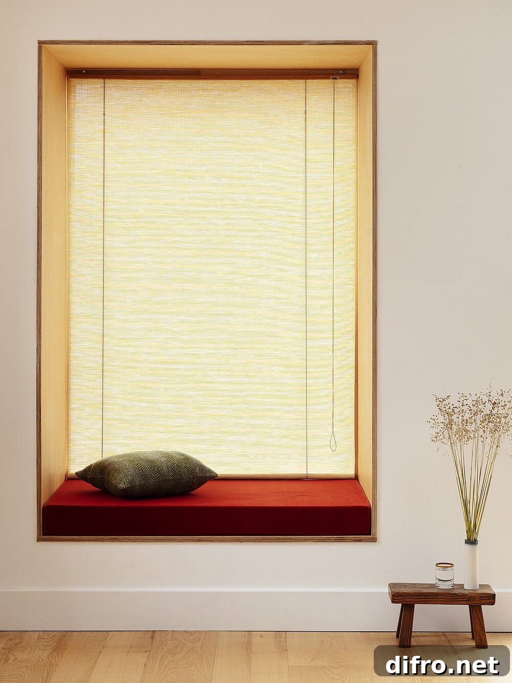 Window cut-outs with wooden frames serve as seats