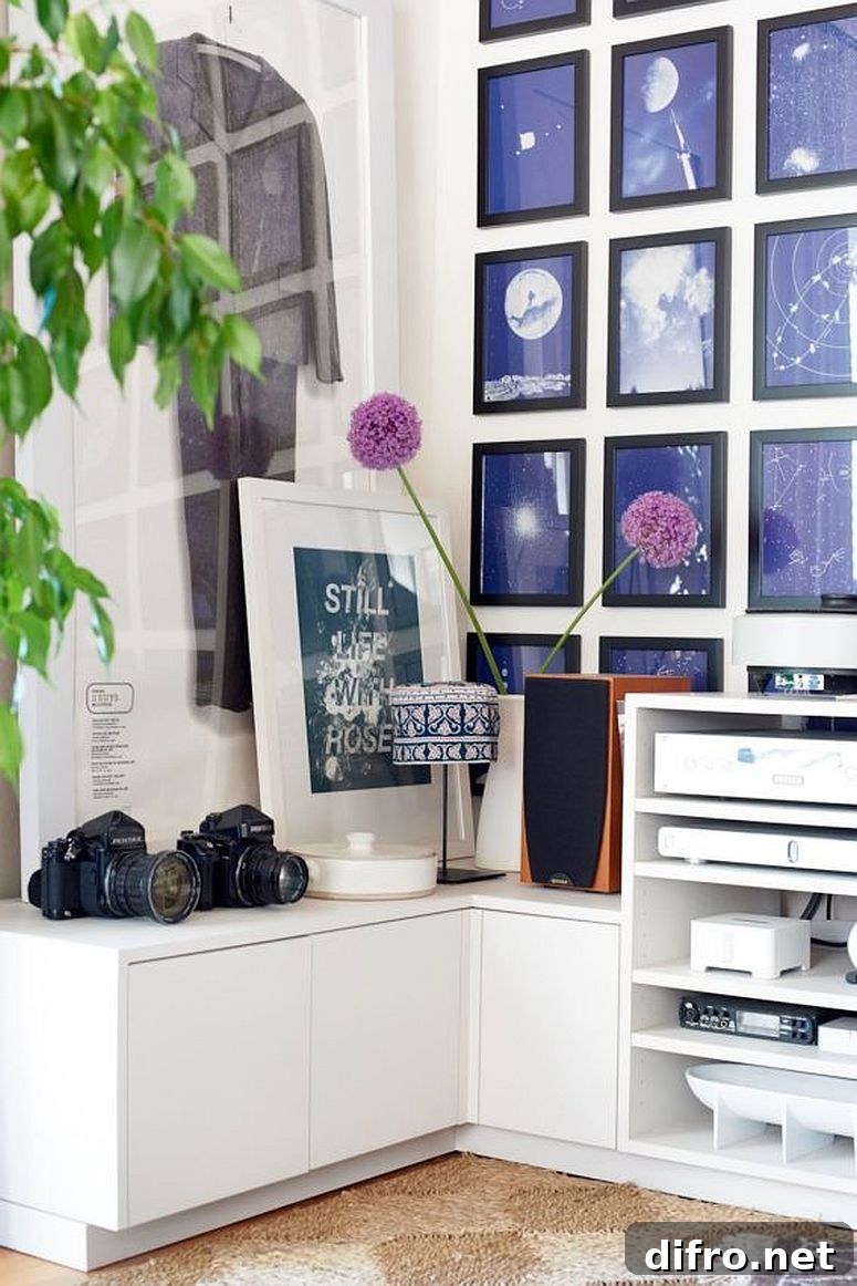 Corner living room wall decorated with framed artwork and photographs