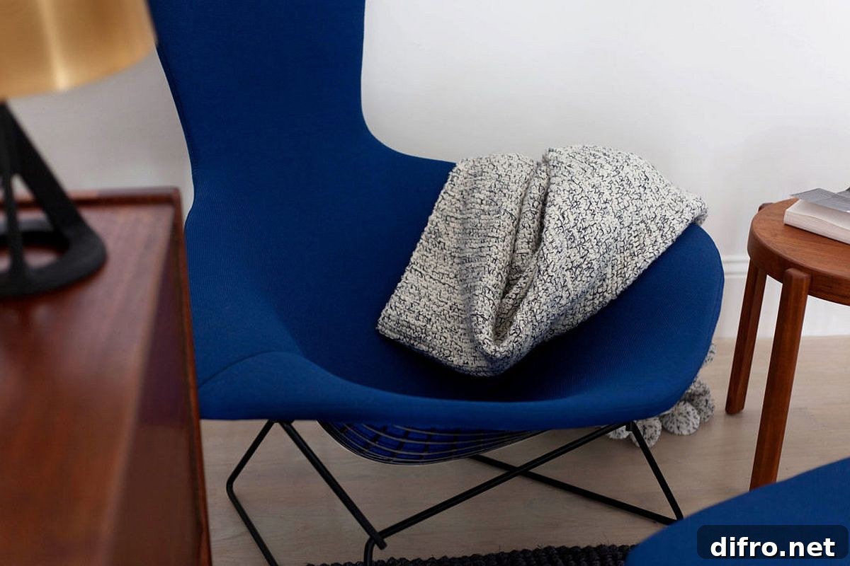 Dark blue accent chair in neutral living room
