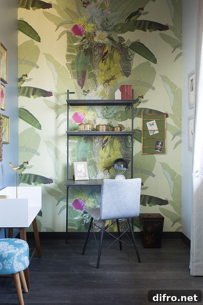Green patterned wallpaper in a small eclectic powder room