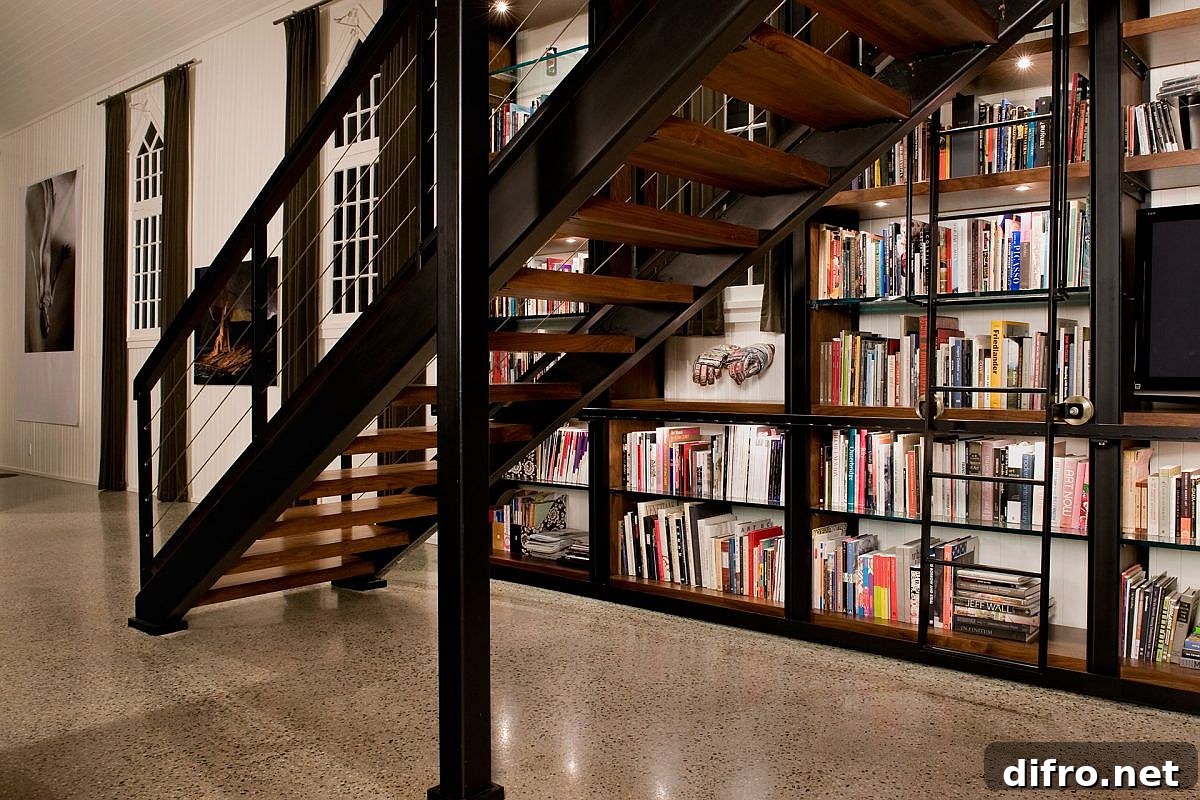 Custom metal and wood bookshelf and staircase inside converted church