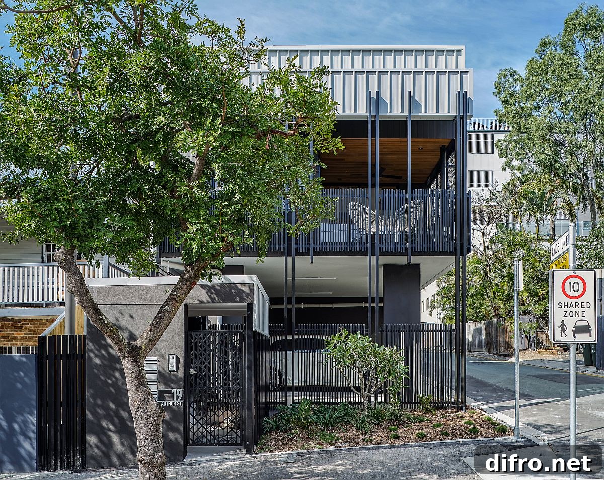Three modern homes replacing a parking lot