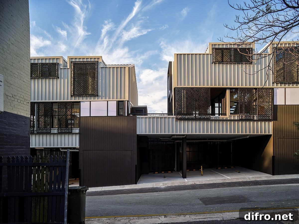 Metallic exterior blending into streetscape