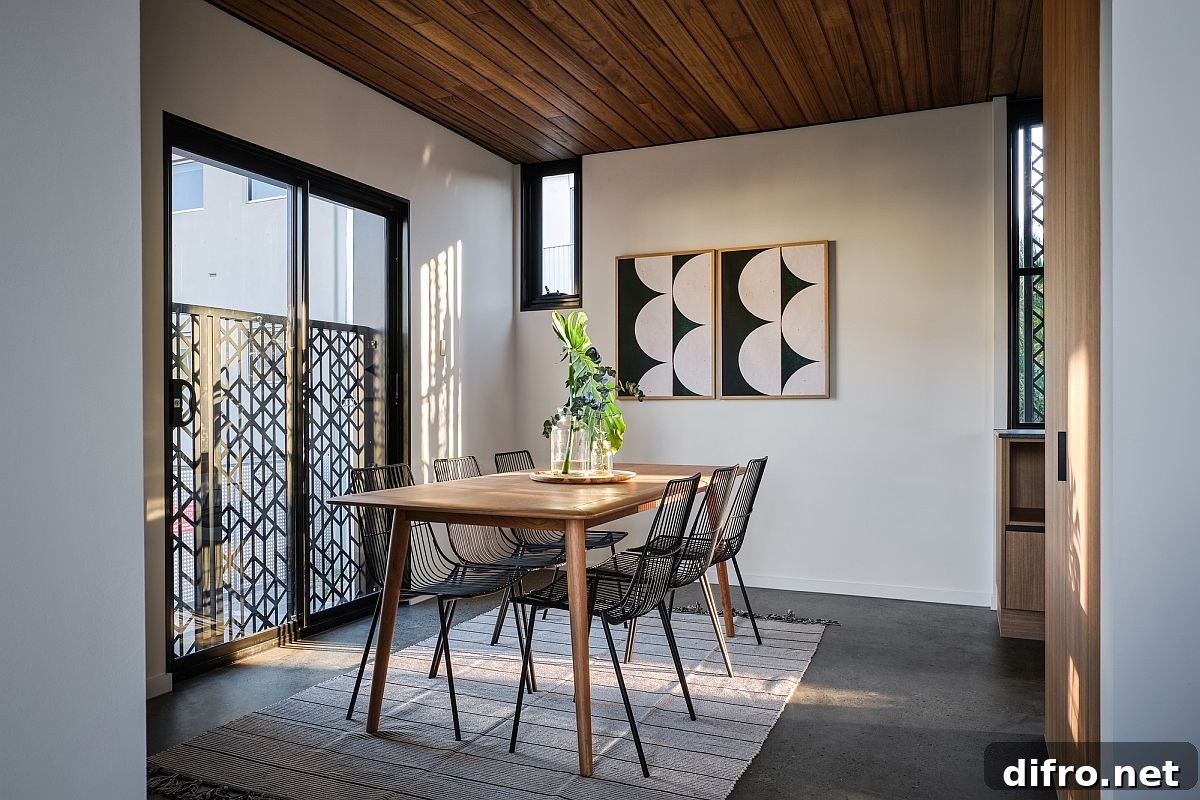 Dining room with wooden ceiling and minimal furnishings