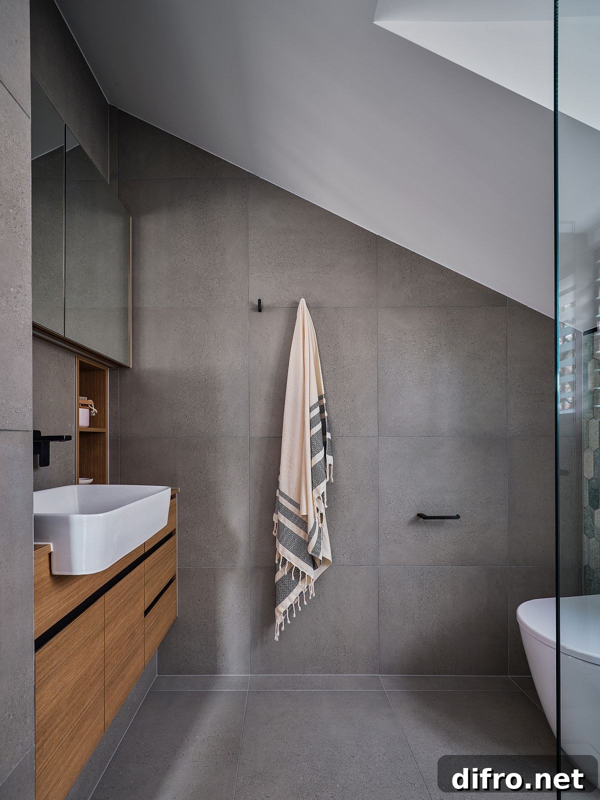 Gray bathroom with floating wooden vanity and white sink