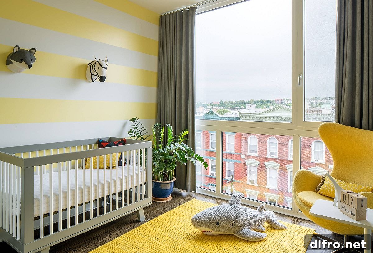 Striped yellow and white accent wall with yellow rug and chair