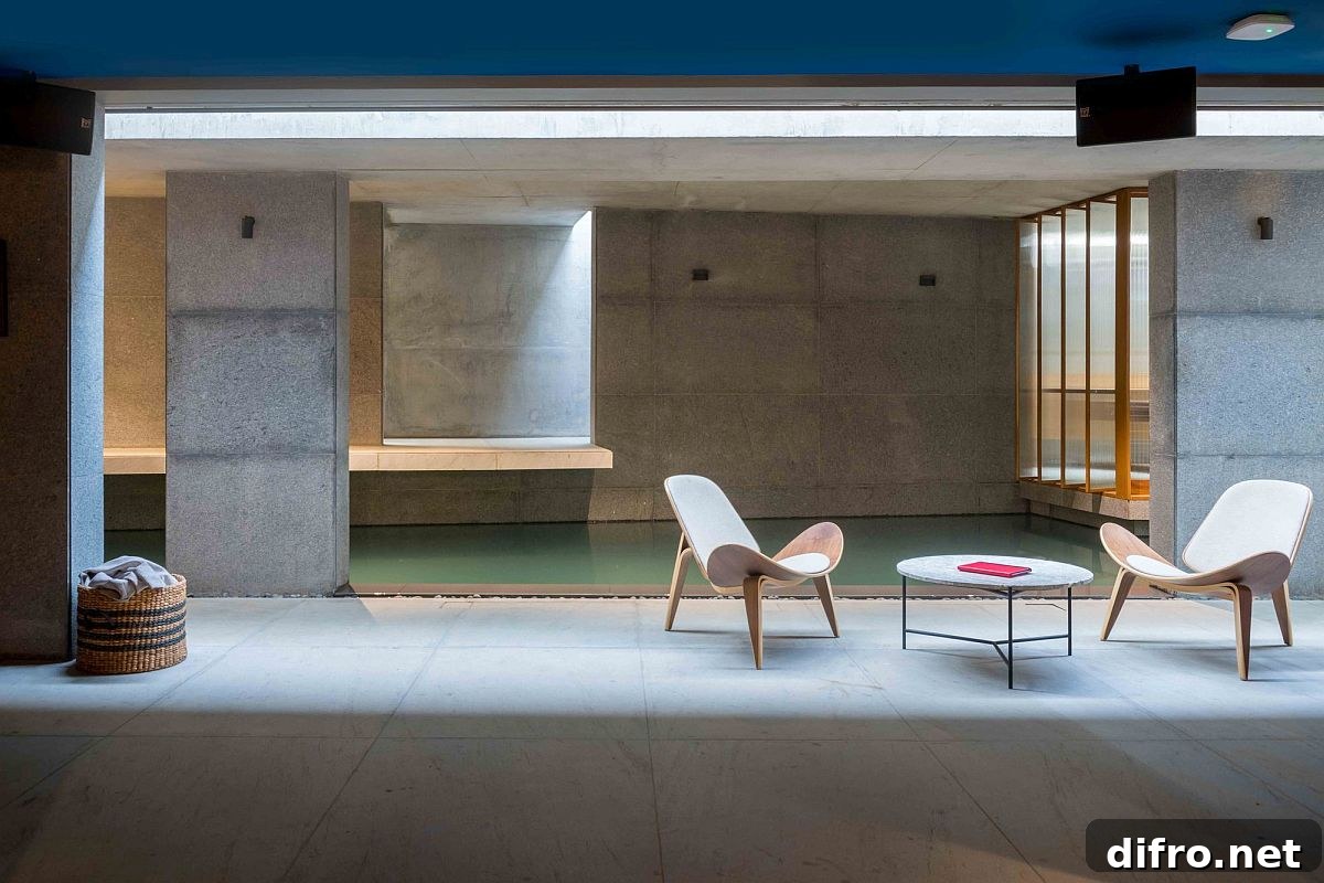 Concrete and gray granite give the pool space a modern minimal look