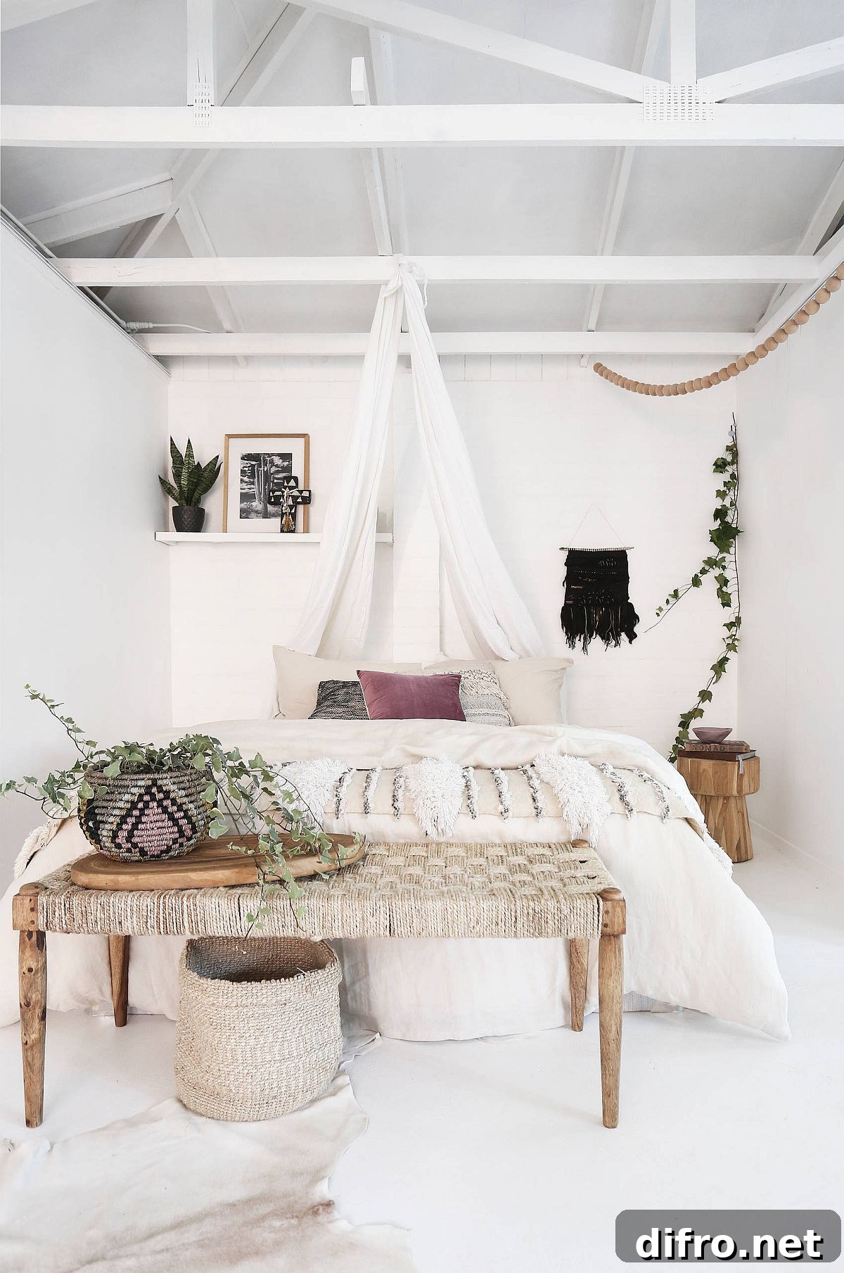 White-themed bohemian bedroom with natural-looking furniture.