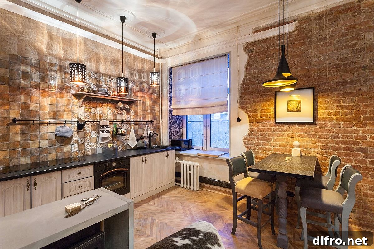Pendant lights creating light and shadow in industrial-eclectic kitchen