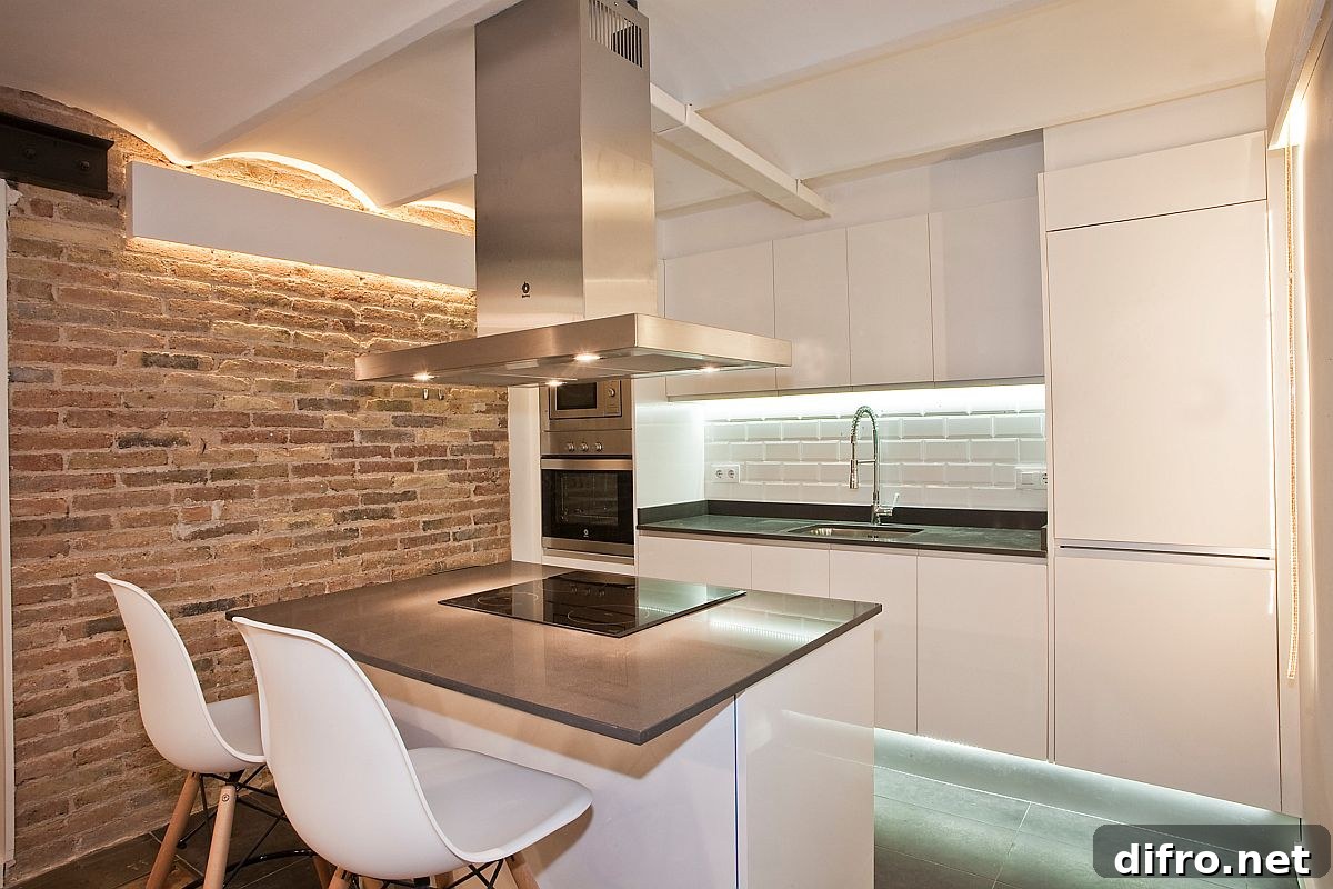 Modern industrial kitchen in Barcelona with exposed brick and white walls