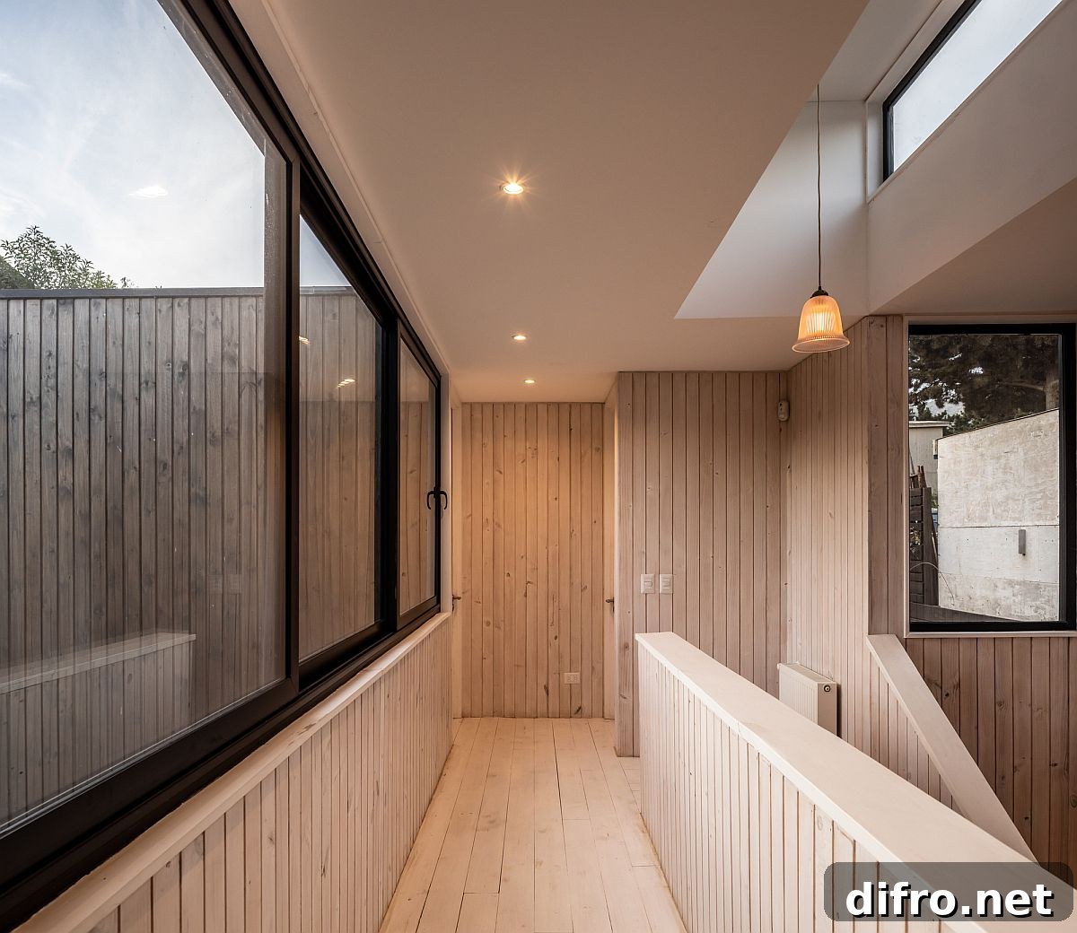 Reclaimed wood creates a cozy modern interior that is filled with natural light