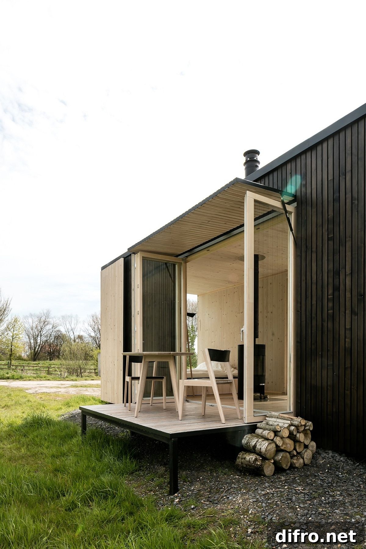 Black exterior and light wood interior of Ark Shelter