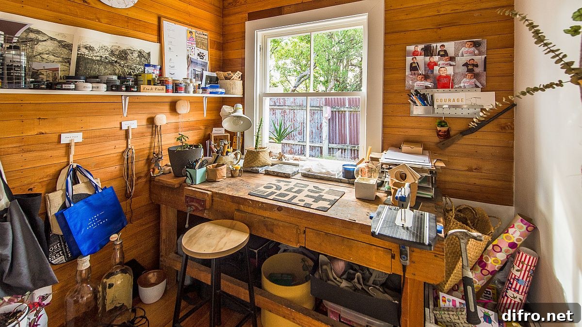 Cozy wooden walls create a warm ambiance in a compact craft room