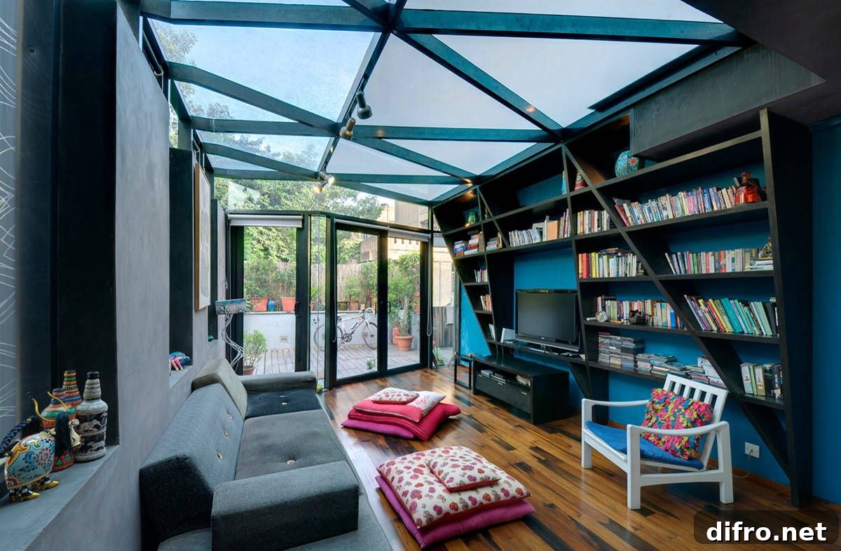 Small contemporary home library with glass roof and blue walls