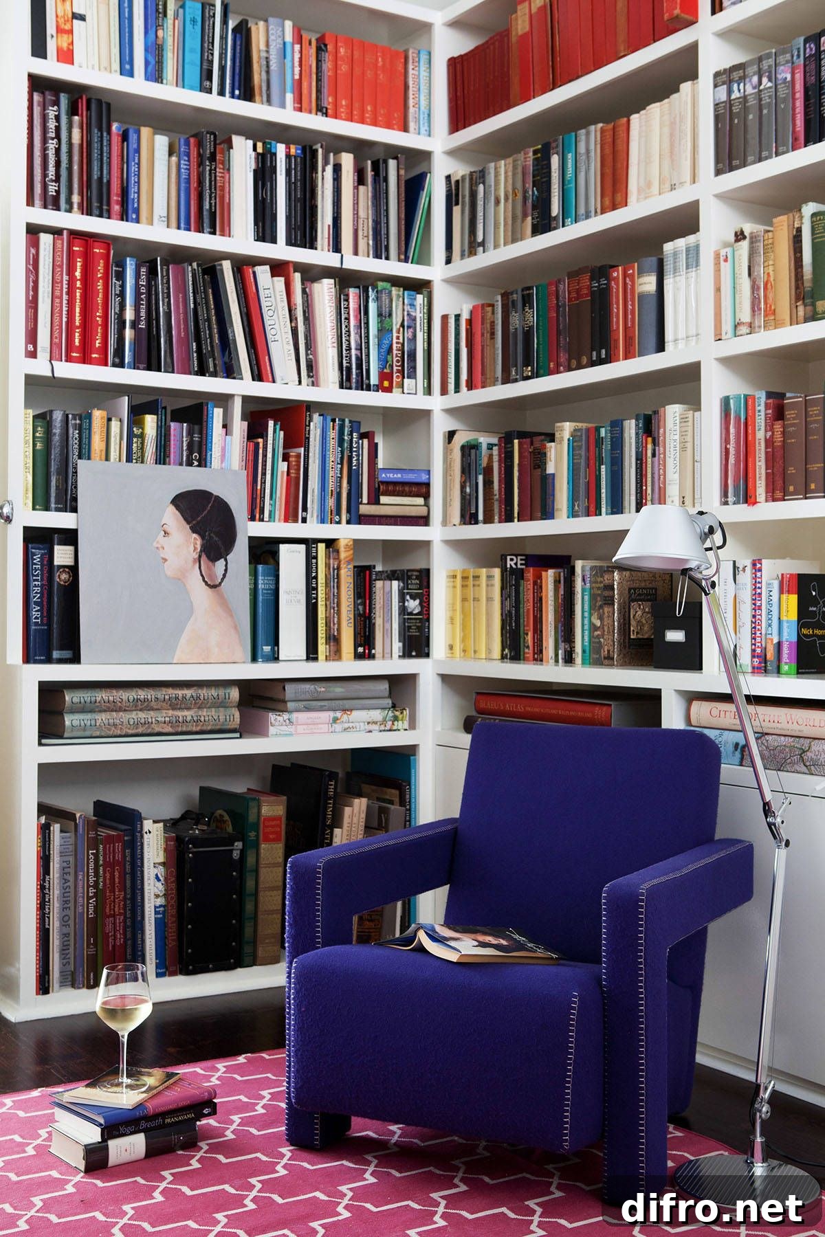 Small corner library with bright rug and chair