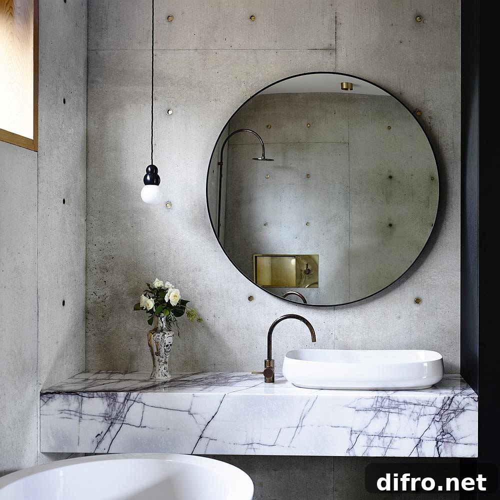 Slim marble vanity in concrete bathroom