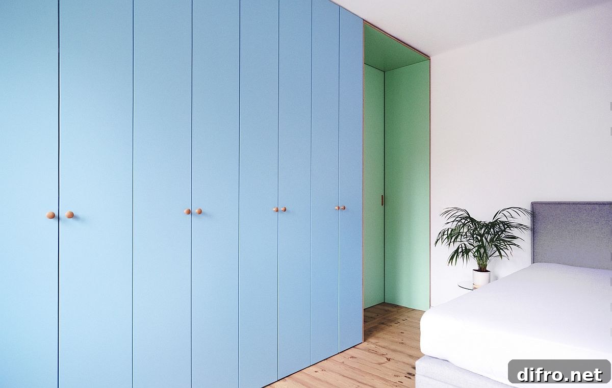 Light blue cabinets and sea green sliding door in bedroom