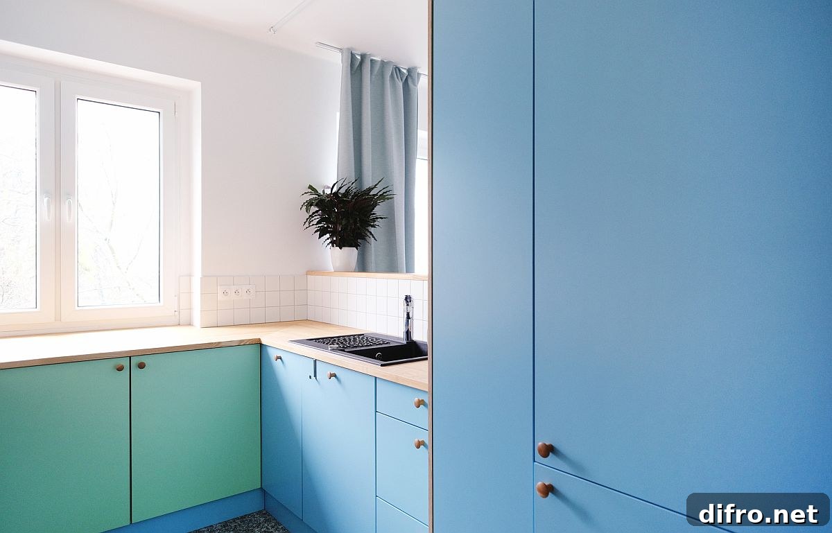 Blue and sea green cabinets in adaptable kitchen