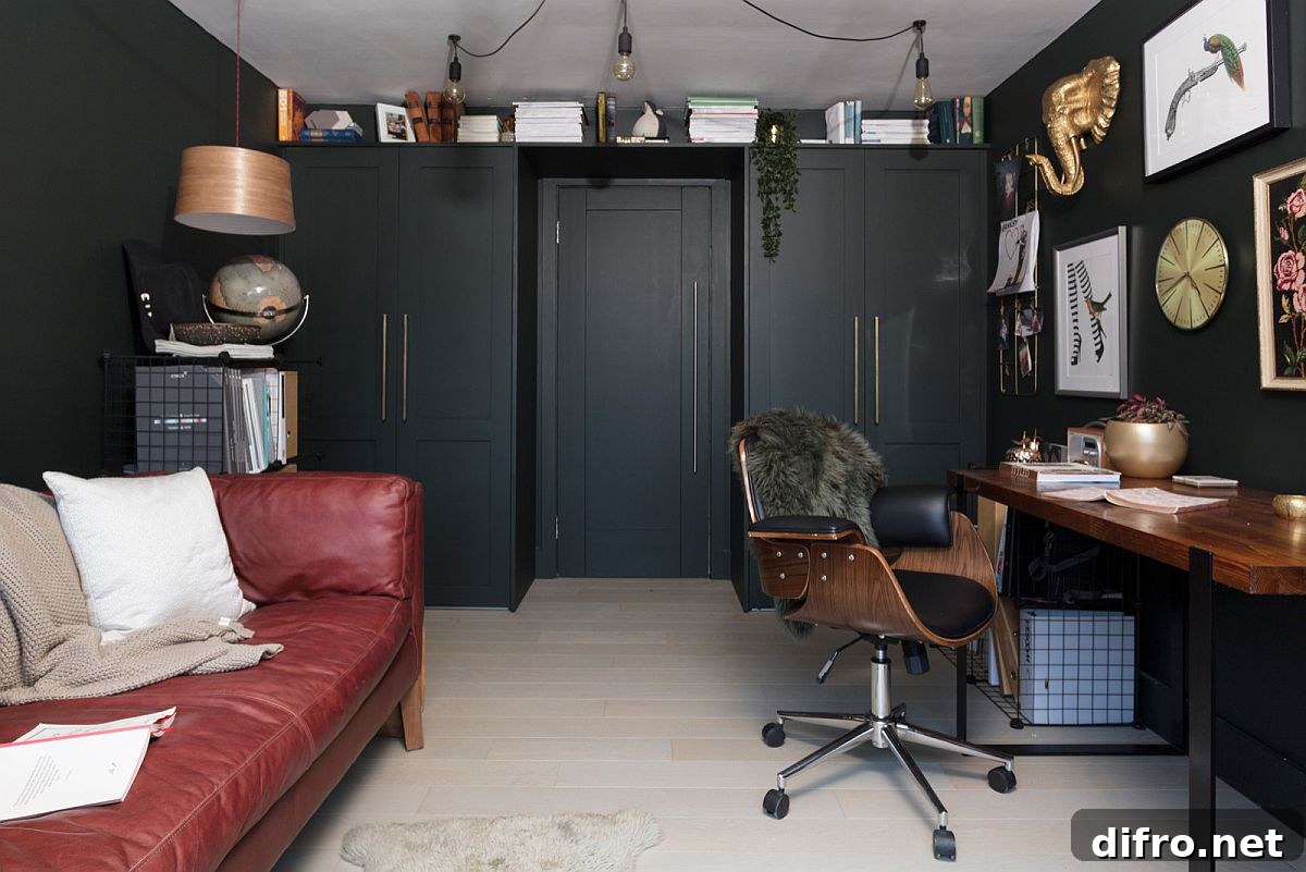 Small modern farmhouse home office with dark red sofa