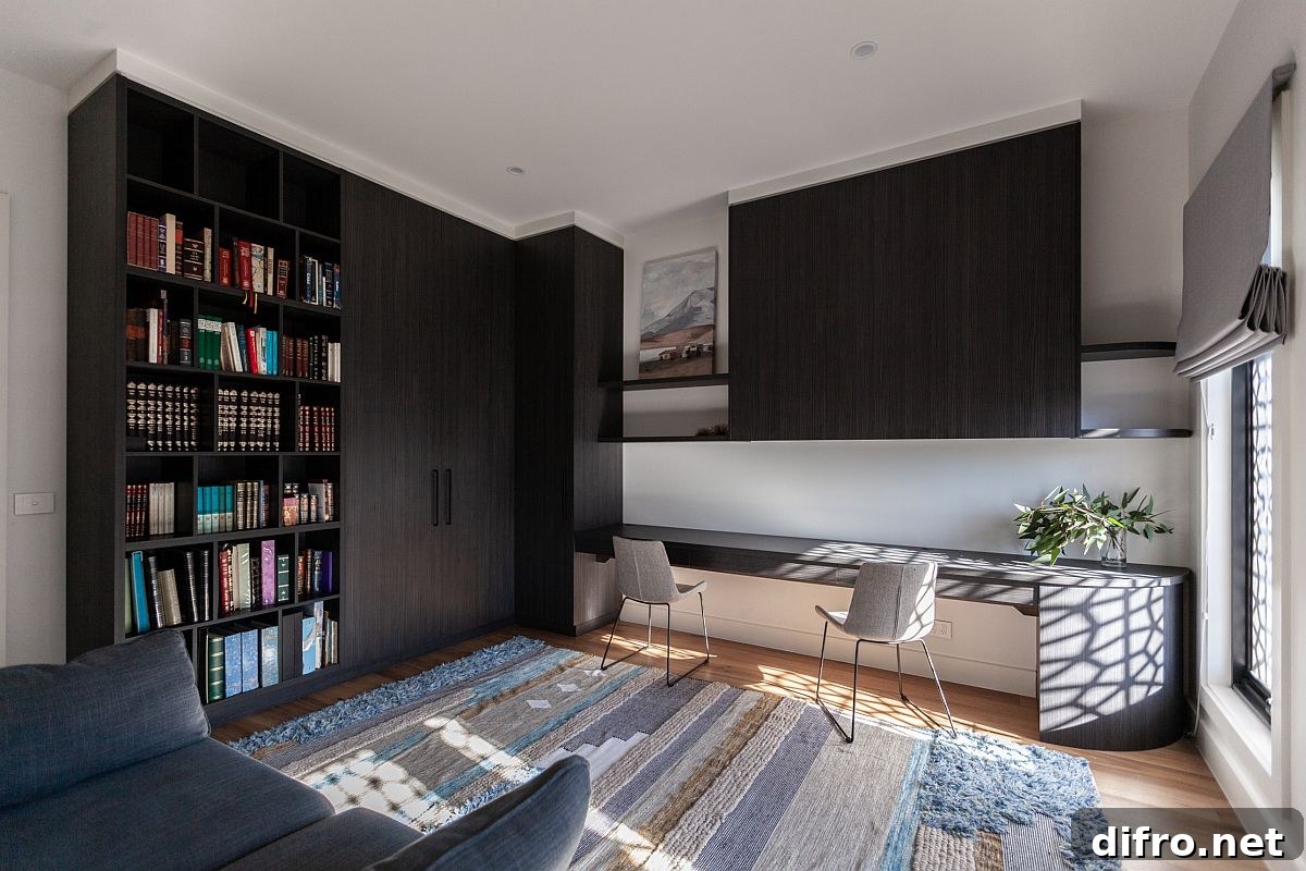 Dark wooden cabinets add black to this lovely and light-filled home office
