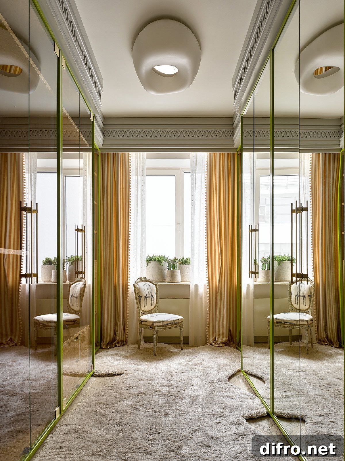 Carpeted walk-in closet with mirrored wardrobes and green accents