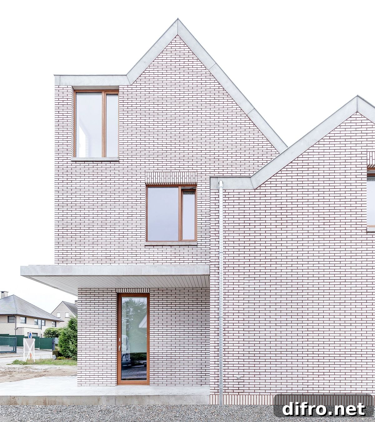Classic outline of the Belgian home in white brick with a lovely red outline