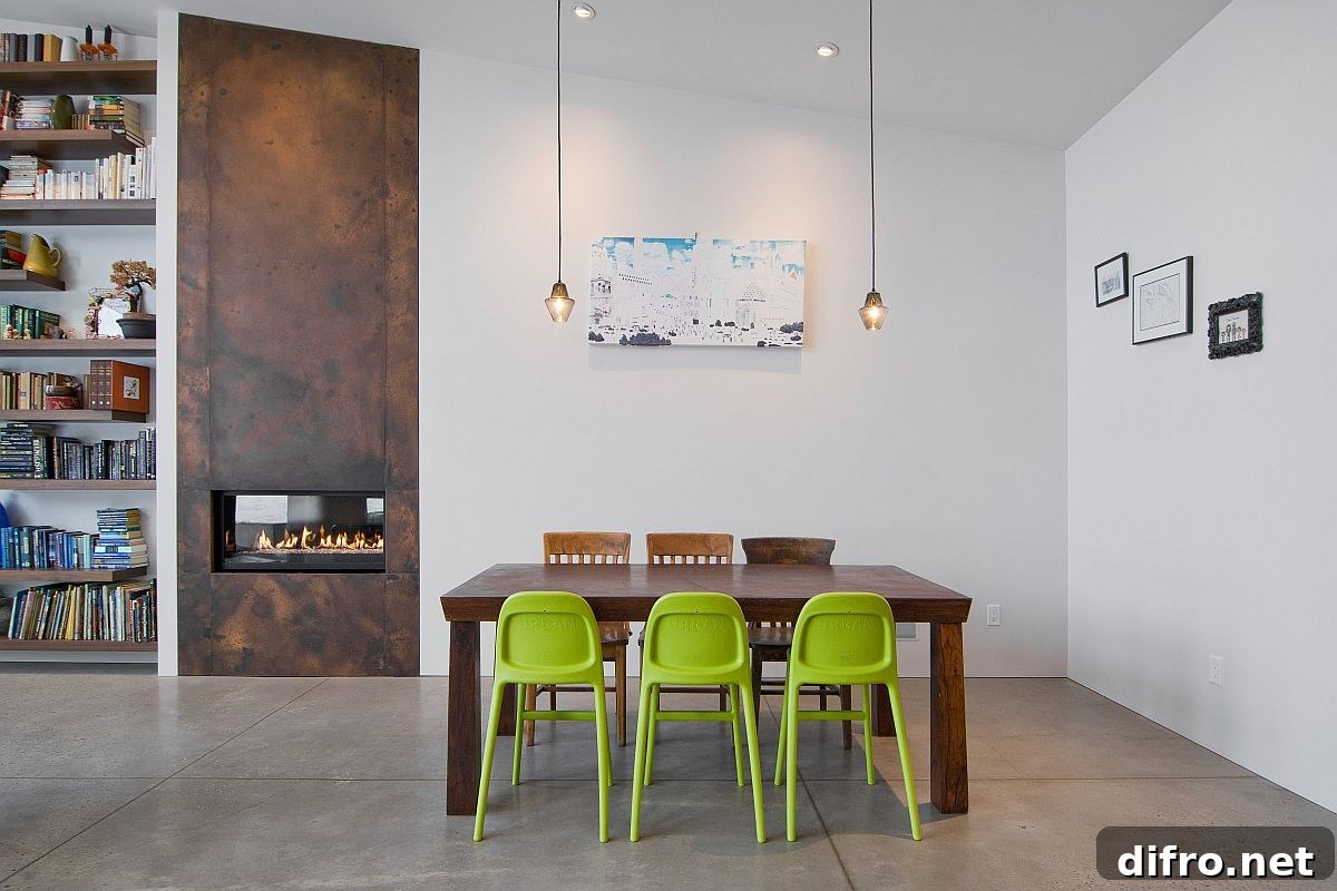 Green chairs adding color to minimal dining room