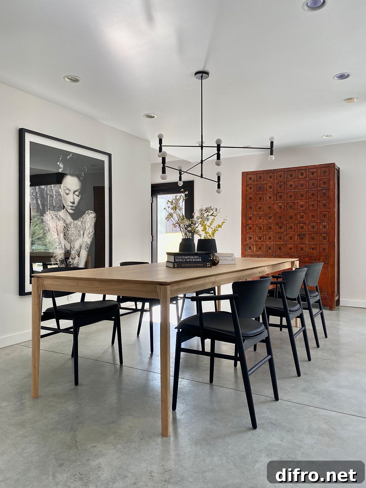 Large colorful wall art in a minimal dining room