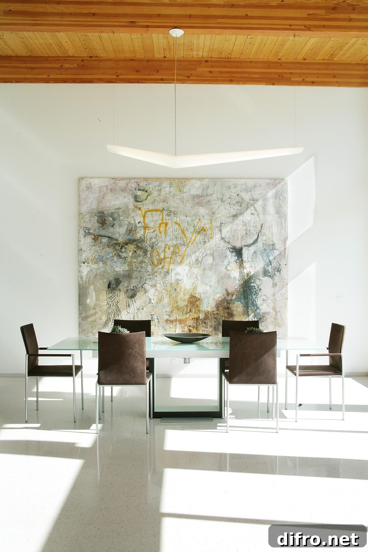 Graffiti inspired wall art in a minimal dining room