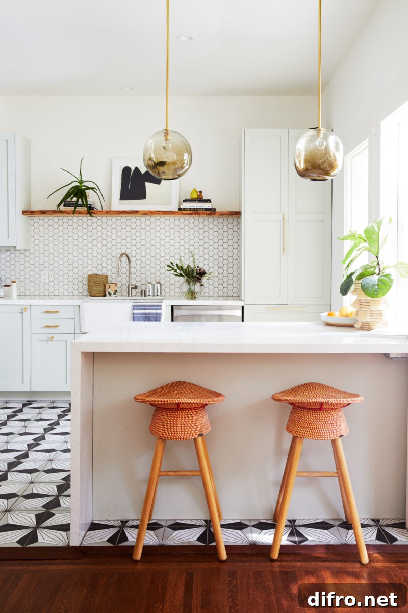 Modern kitchen with bold black and white patterned floor tile